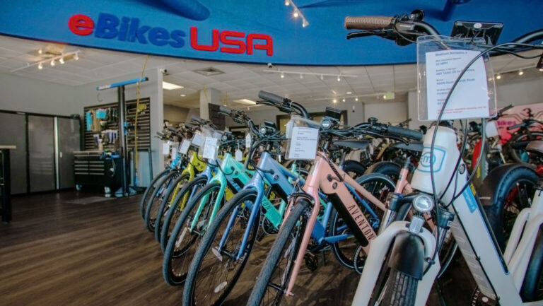 Line-up of different electric bike models in the eBikes USA showroom.