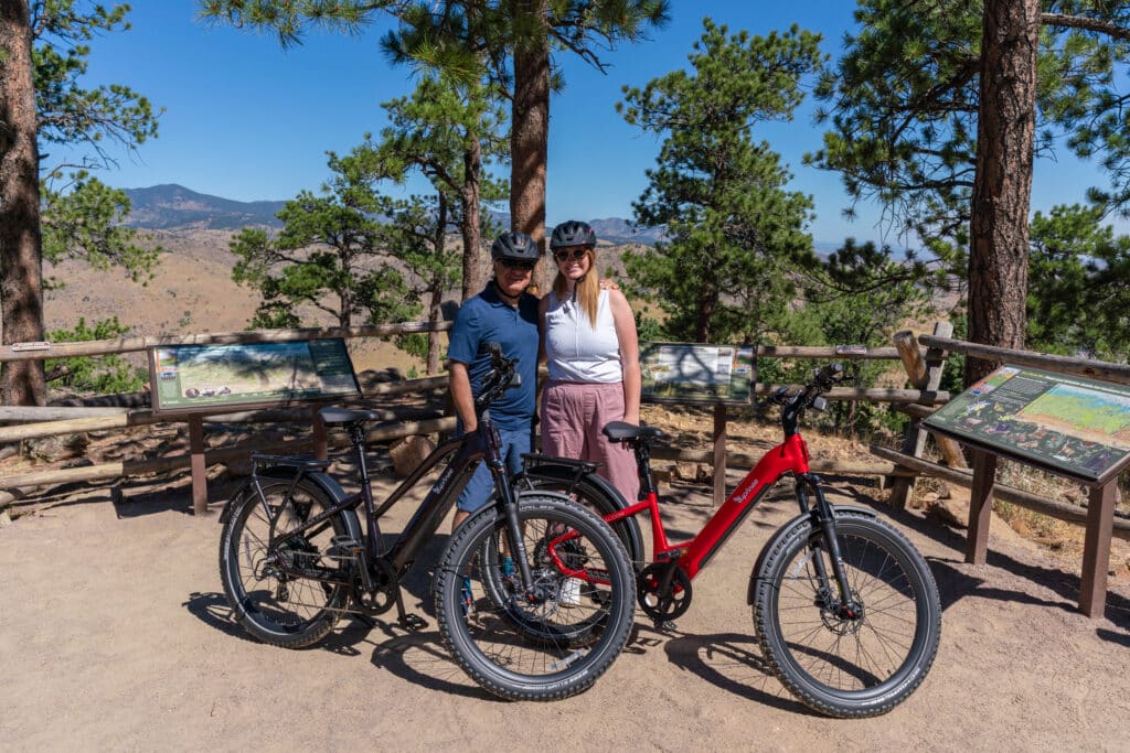 A father and daughter smiling with their two Euphree ebikes.