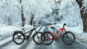 Two ebikes on a snowy winter road.