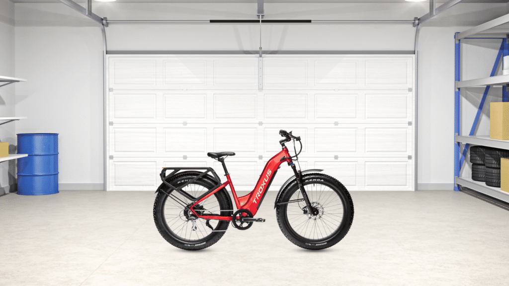 A red Troxus ebike in a clean garage.